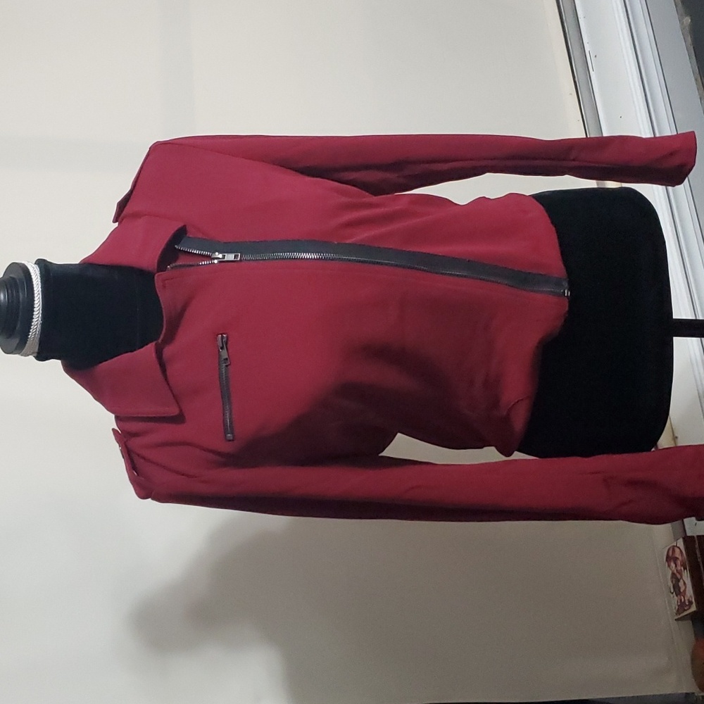 On Twelfth burgundy jacket.